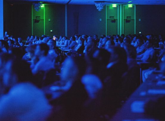 one-face-lit-up-in-all-the-blue-faces-at-this-engineering-conference_t20_WKYXZL